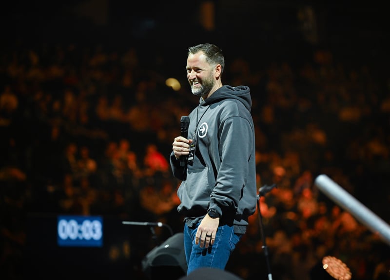 Taylor Stutts speaking on stage